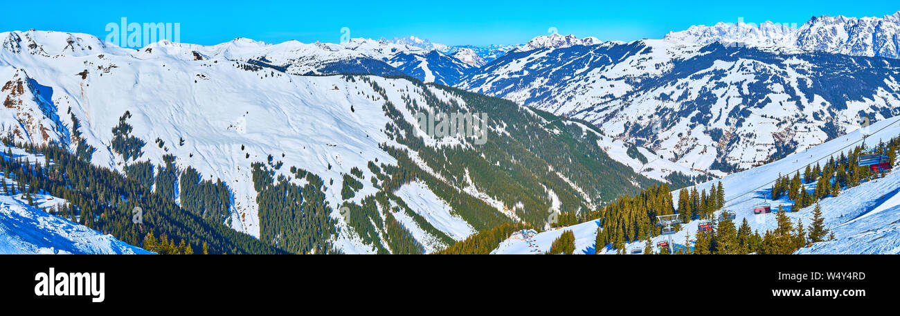 Schmittenhohe  mount opens the view on sharp Alpine peaks, looking like endless, covered with coniferous forests and pure winter snow, Zell am See, Au Stock Photo