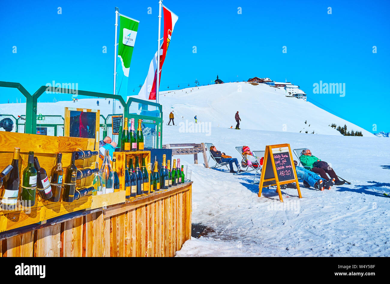 ZELL AM SEE, AUSTRIA - FEBRUARY 28, 2019: The open air lounge bar on the top of Schmitten mount offers large amount of famous alcohol drinks, on Febru Stock Photo