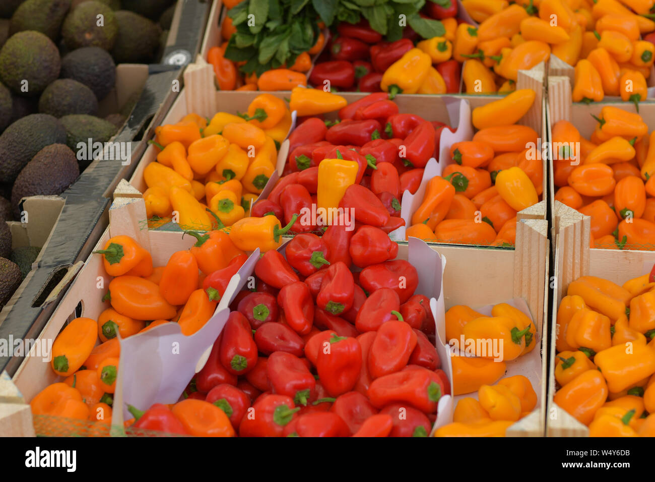 Red and yellow peppers on the market Stock Photo - Alamy