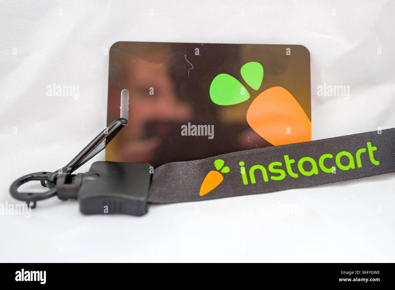 Close-up of Instacart ID card and lanyard, typically worn by workers for the gig economy grocery delivery service while shopping for clients in grocery stores, San Ramon, California, May 7, 2019. () Stock Photo