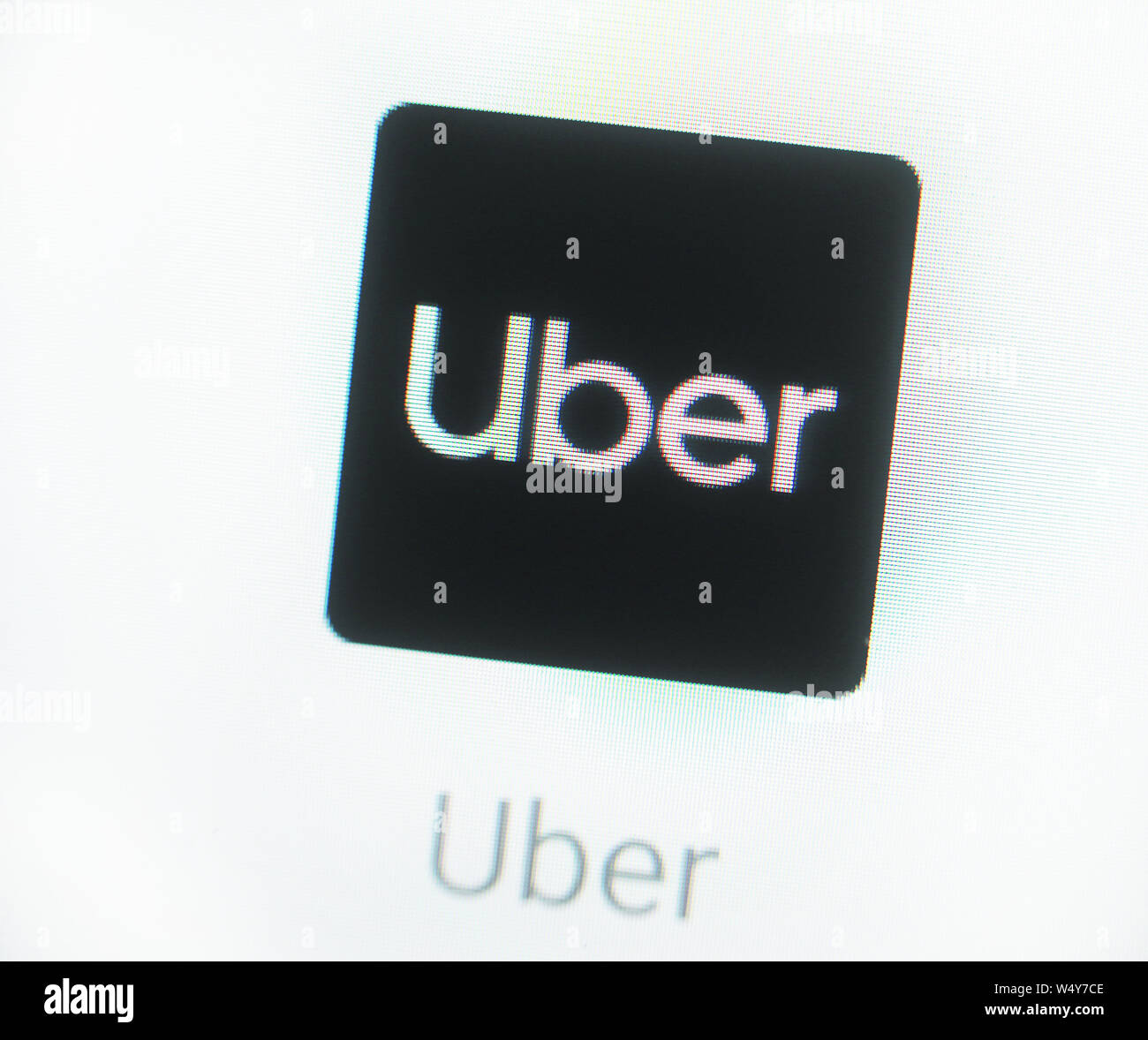 Uber application icon on computer display. Uber Technologies, Inc. is an American multinational transportation network company Stock Photo