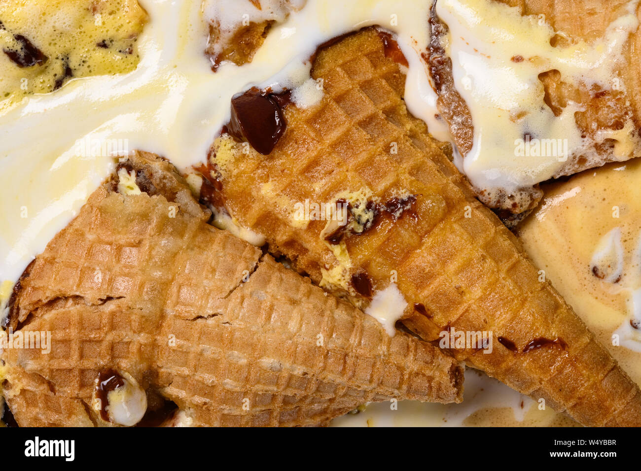 close up of multiple flavor ice cream cones melted Stock Photo Alamy
