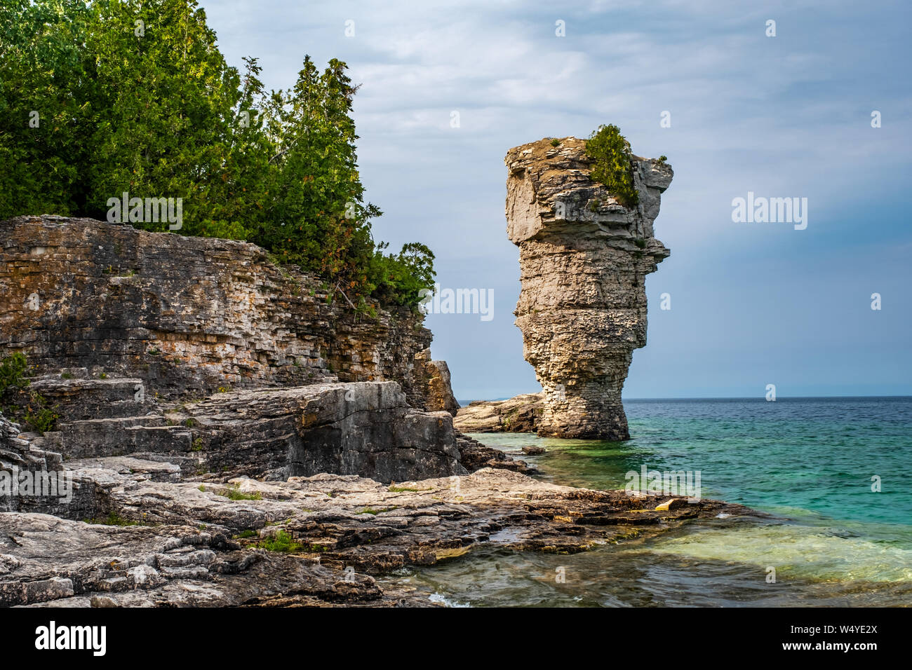 On Flowerpot island in Fathom Five National Marine Park, one of the two rock pillars or sea stacks, rise from the waters of Georgian Bay. Stock Photo