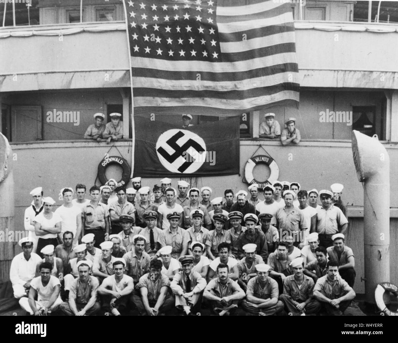 Crewmembers of USS Omaha (CL-4) aboard the German blockade runner Odenwald, 18 November 1941 (80-G-464023). Stock Photo