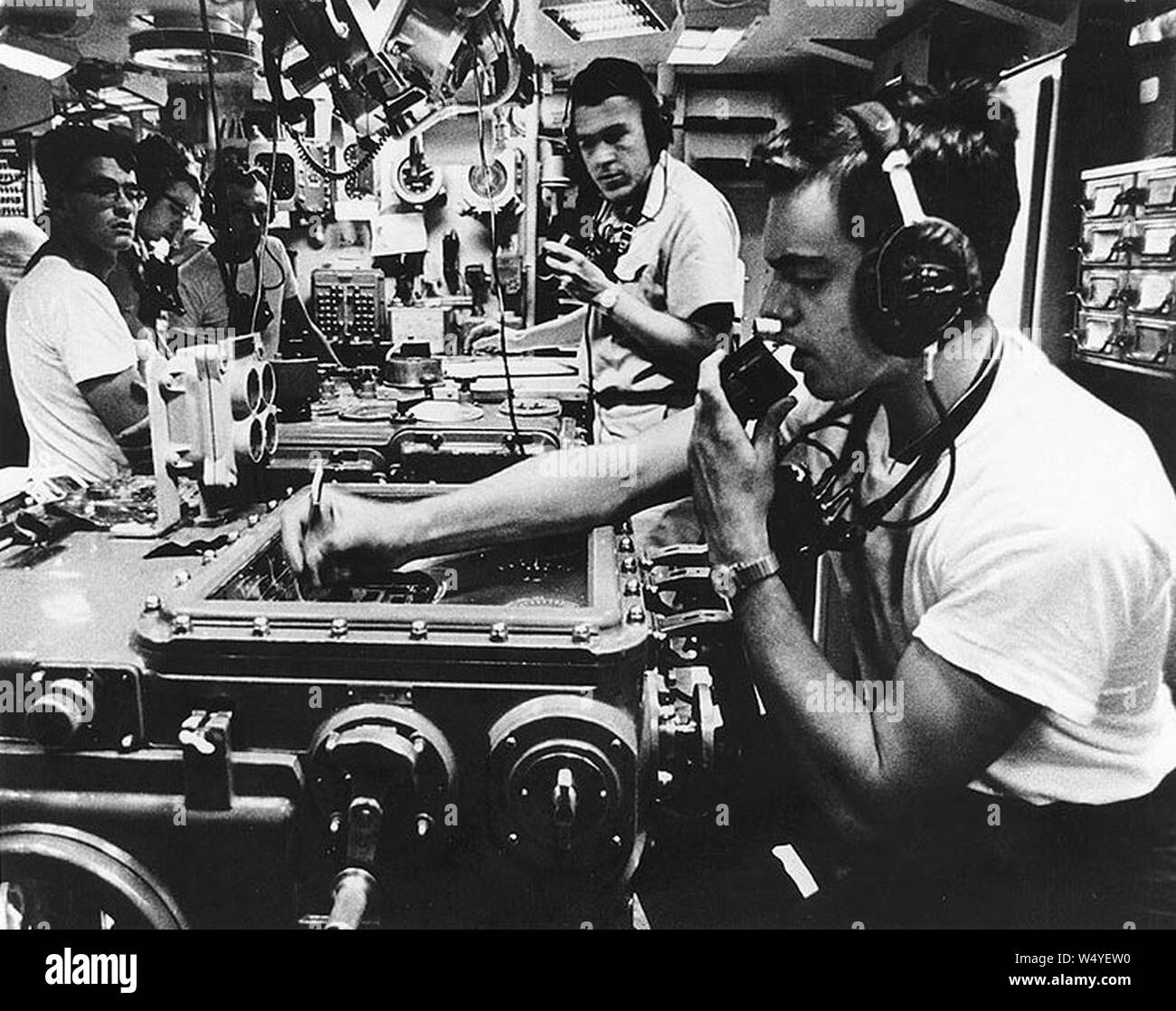 Crewmen in the Main Battery Plot of USS Canberra (CAG-2) off Vietnam in March 1967 (USN 1142153). Stock Photo