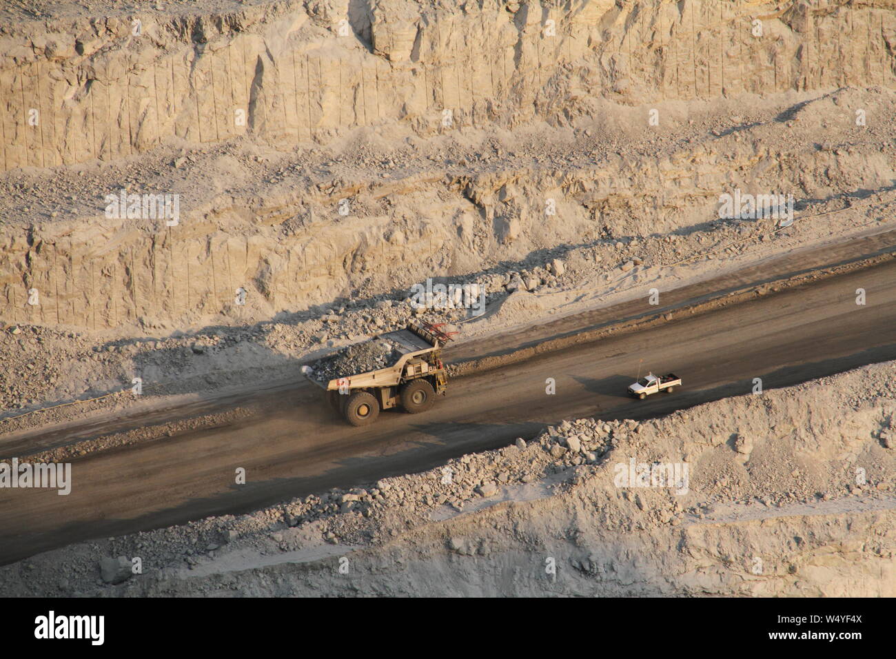 Swakopmund, Namibia. 25th July, 2019. A truck drives in the pit of Rossing Mine near the town of Swakopmund, Namibia, on July 25, 2019. The Anglo-Australian mining giant Rio Tinto officially handed over Namibian uranium mine Rossing to its new majority shareholder, China National Nuclear Corporation (CNNC) at an event Thursday in Rossing Mine near the coastal town of Swakopmund. Credit: Wu Changwei/Xinhua/Alamy Live News Stock Photo
