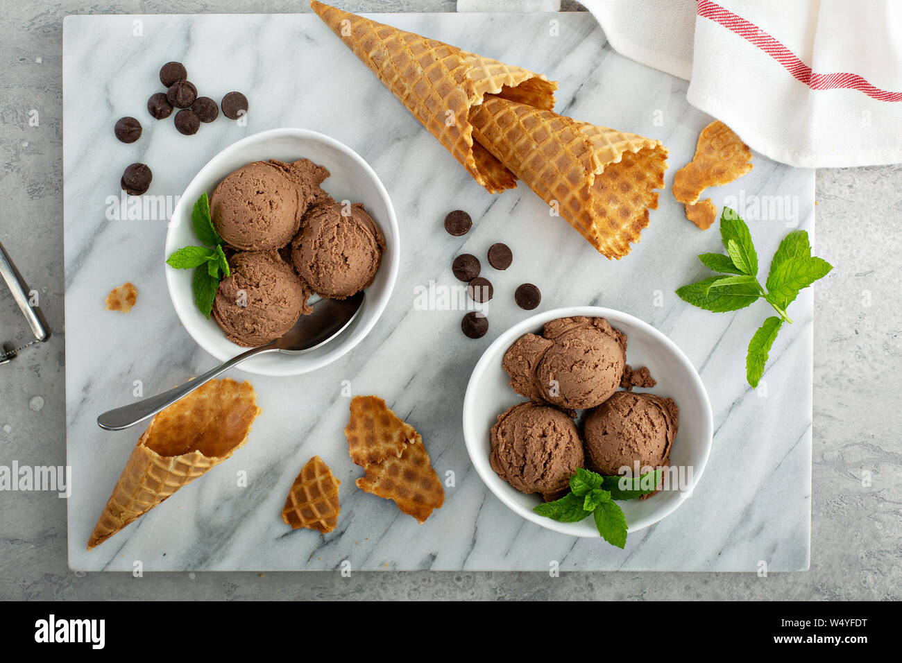 SImple chocolate ice cream in a white bowl with mint Stock Photo - Alamy