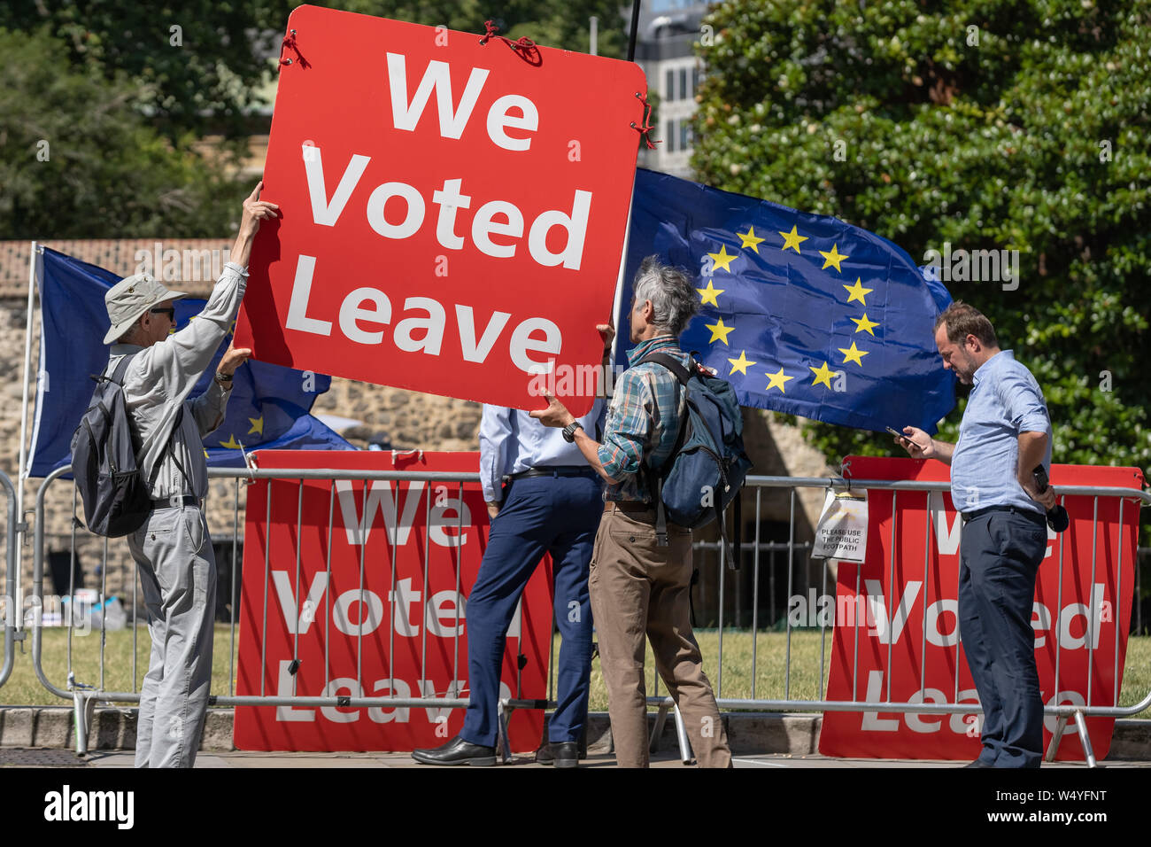 Pro-Brexit and EU Remain supporters continue their weekly campaign vigils opposite the Houses of Parliament waving British and European flags. London, Stock Photo