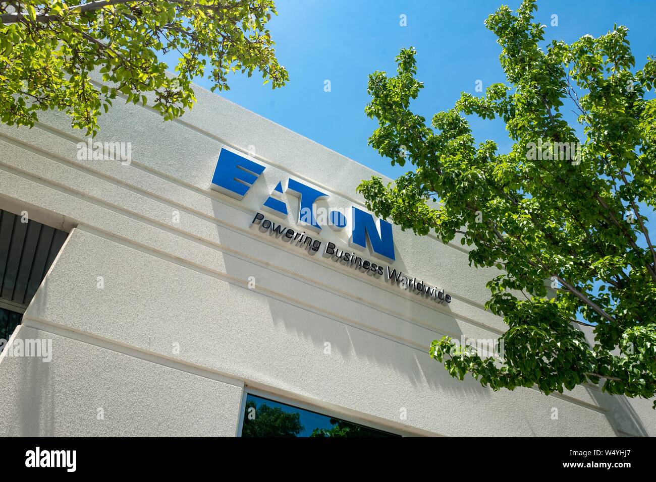 Low-angle view of sign with logo on facade at office of power management company Eaton in Pleasanton, California, July 2, 2019. () Stock Photo