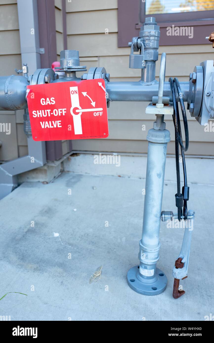 Earthquake gas shutoff valve on outside of building in Lafayette, California, with attached instructions and wrench, designed to allow fast shutoff of gas flow in the event of earthquake damage, July 16, 2019. () Stock Photo