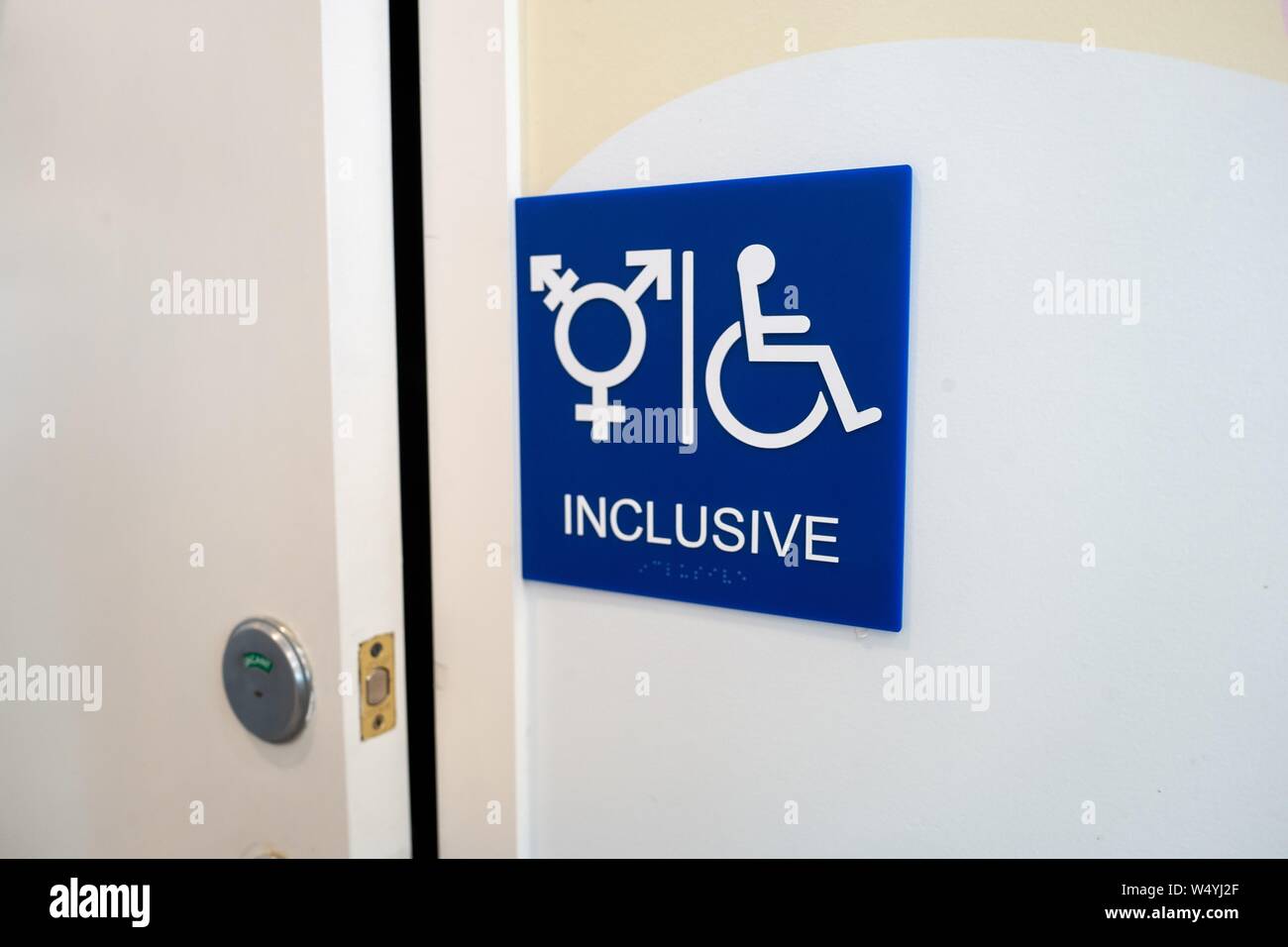 Sign for inclusive restroom, with symbol indicating male, female and transgender as well as handicapped symbol, part of LGBT rights initiatives in the Mission District neighborhood of San Francisco, California, July 18, 2019. () Stock Photo