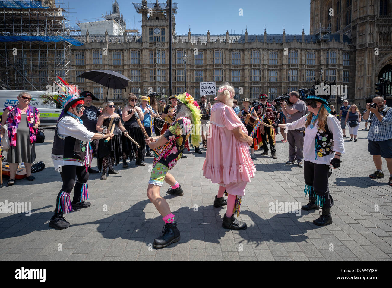 Morris dancers protest outside Parliament in Westminster against the Government’s decision to move next year’s May Day bank holiday Stock Photo