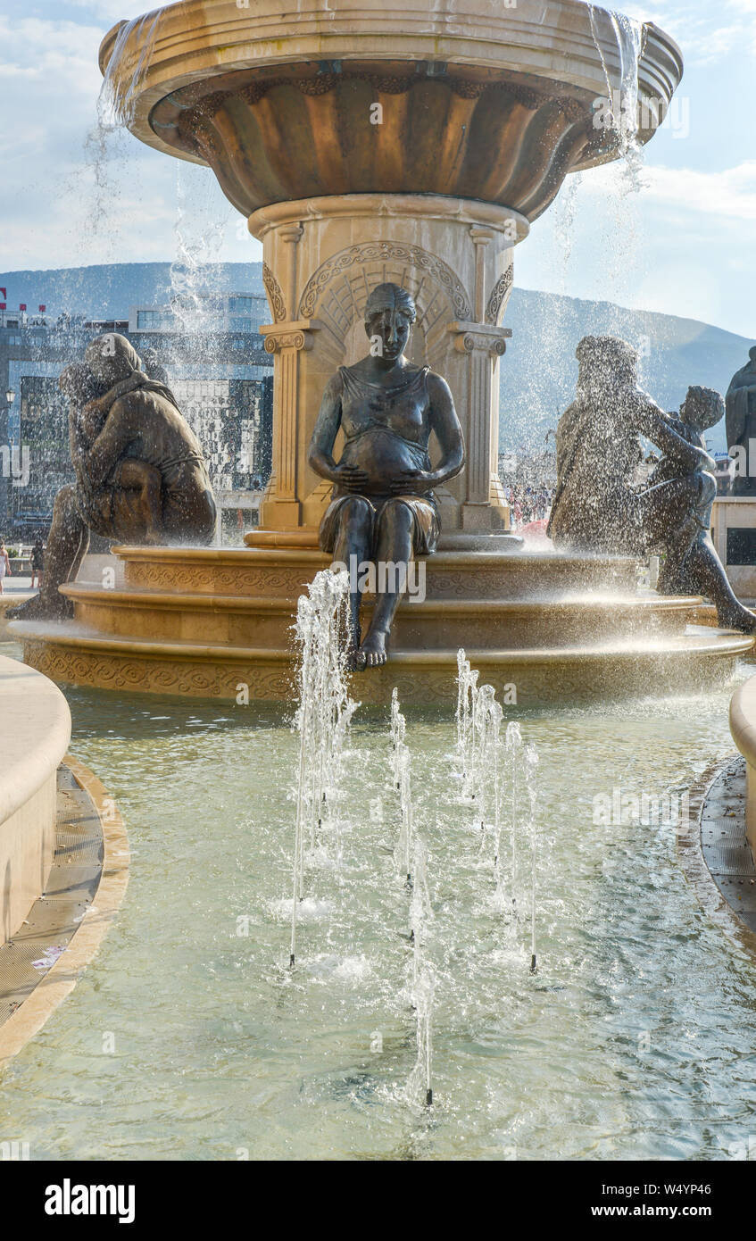 2018:SKOPJE,REPUBLIC OF NORTH MACEDONIA-AUGUST 25 2018:Statues and fountains at the Place next tothe Museum of Archaeology and Stone Bridge. Stock Photo