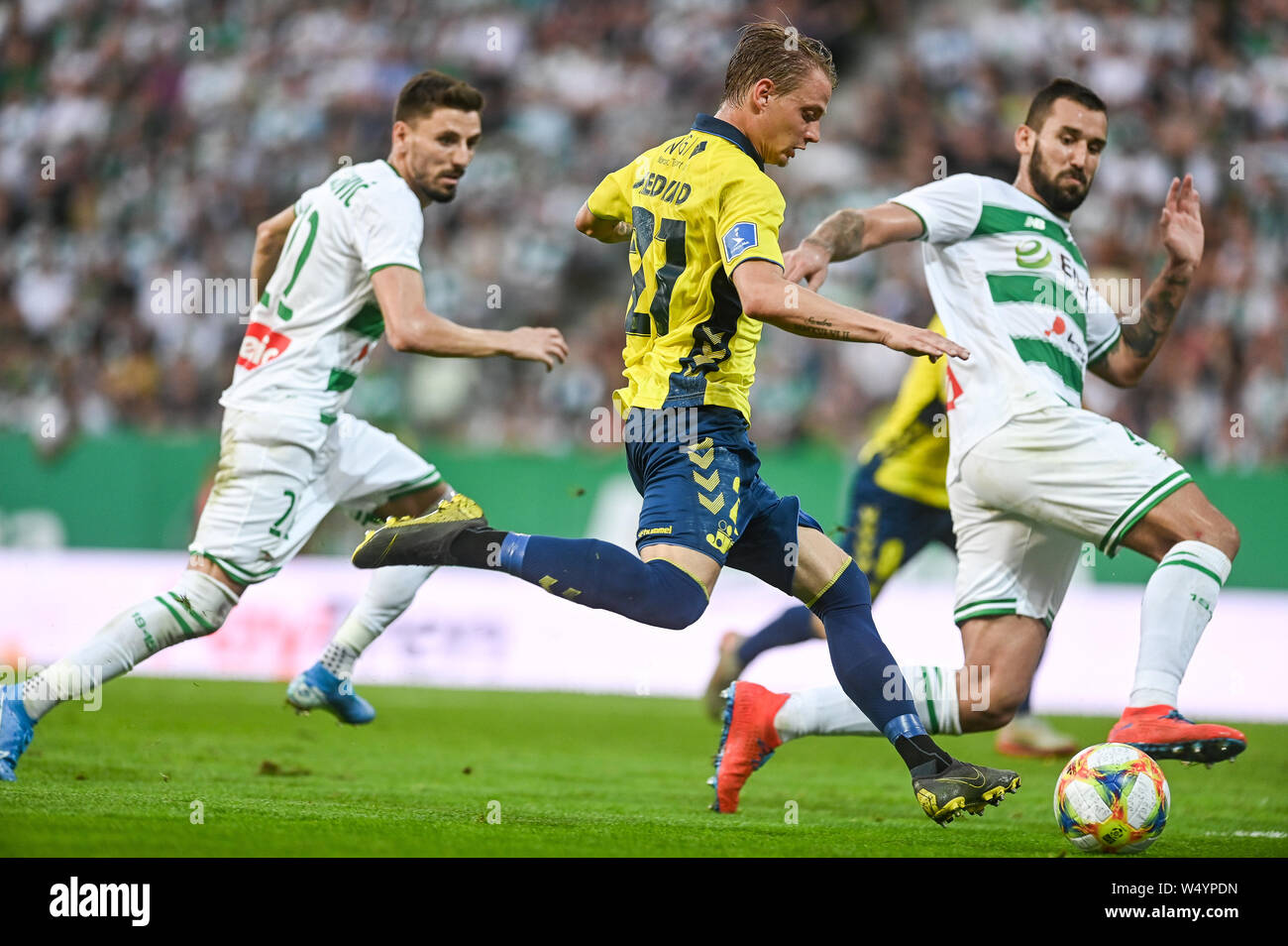 Filip Mladenovic from Lechia Gdansk (L) Simon Hedlund from Brondby IF (C) and Blazej Augustyn from Lechia Gdansk (R) are seen in action during the UEFA Europa League Qualifiers match between Lechia Gdansk and Brondby IF at Energa Stadium.(Final score; Lechia Gdansk 2:1 Brondby IF) Stock Photo