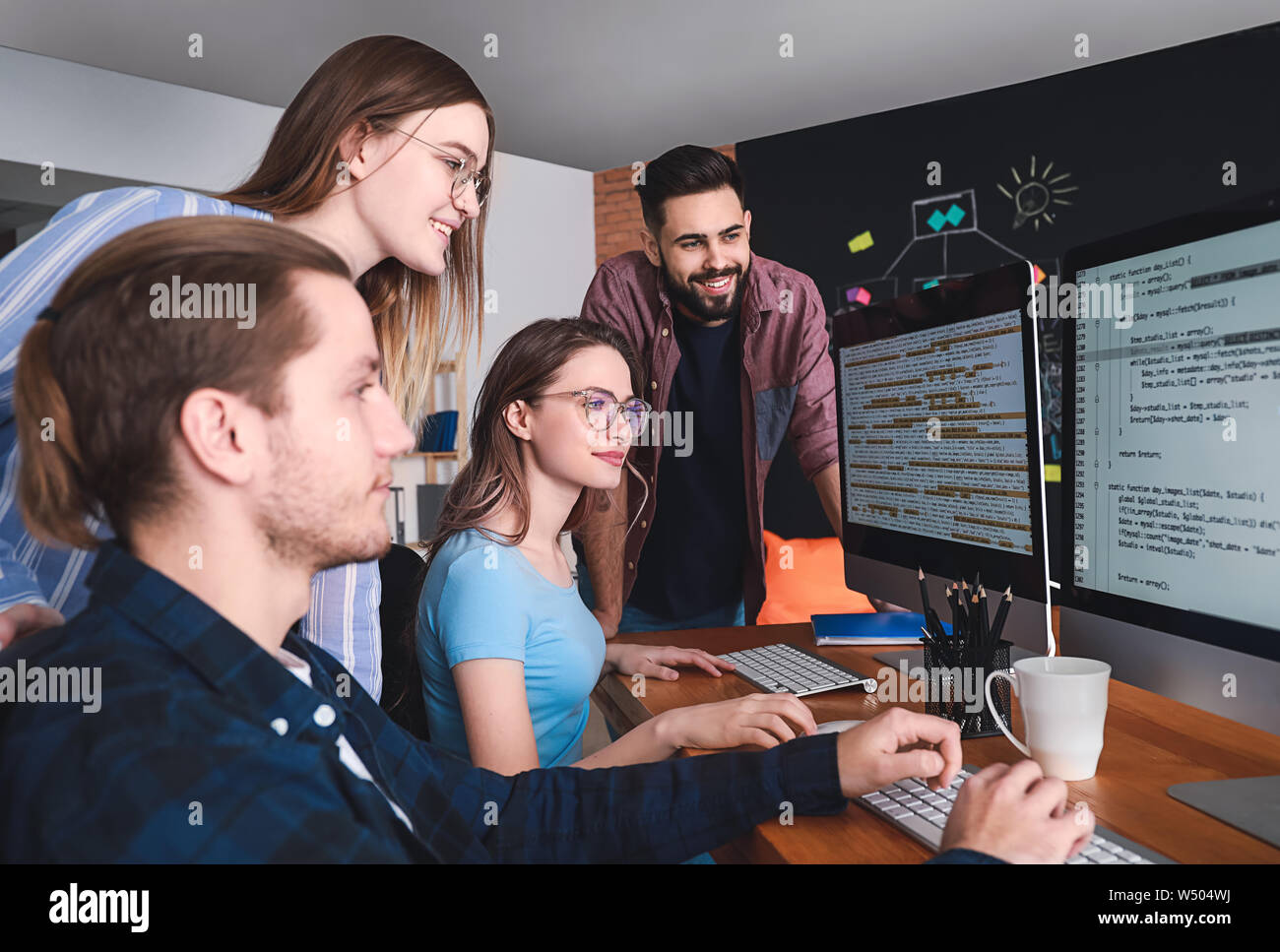 Computer programmers discussing hi-res stock photography and images - Alamy