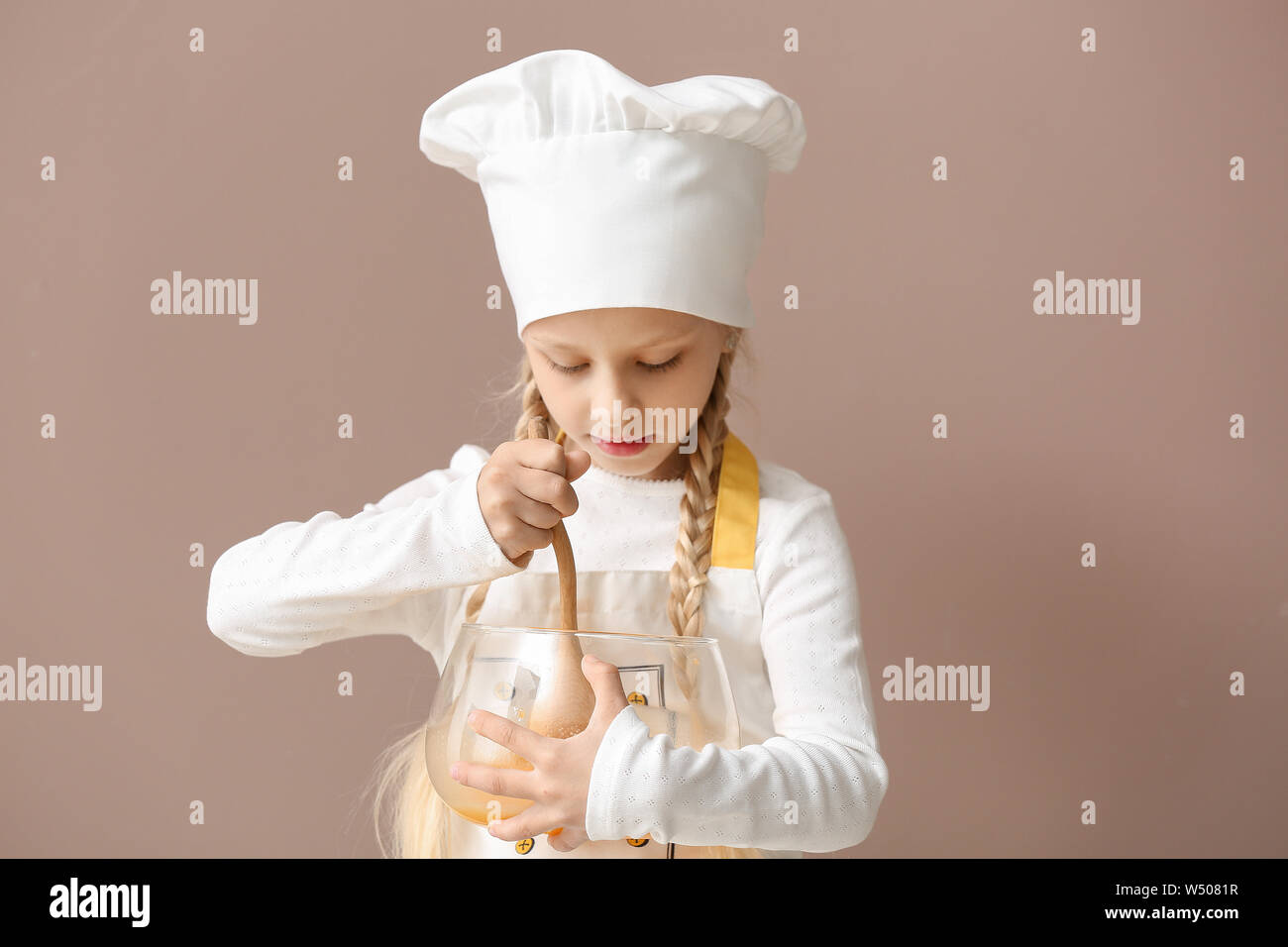 Cute little chef on color background Stock Photo - Alamy