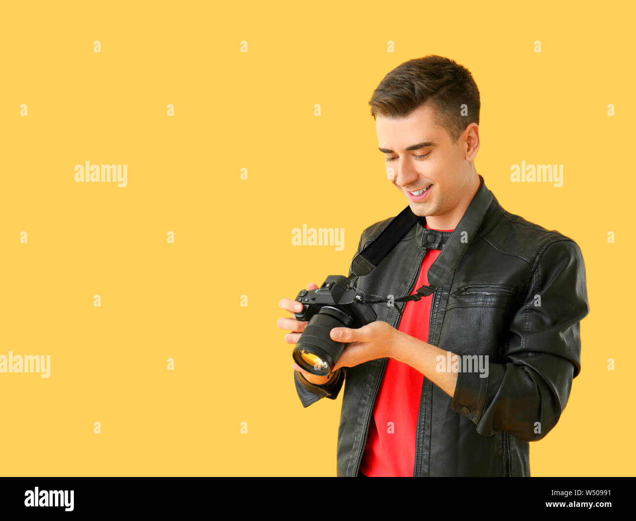 Male photographer on color background Stock Photo - Alamy
