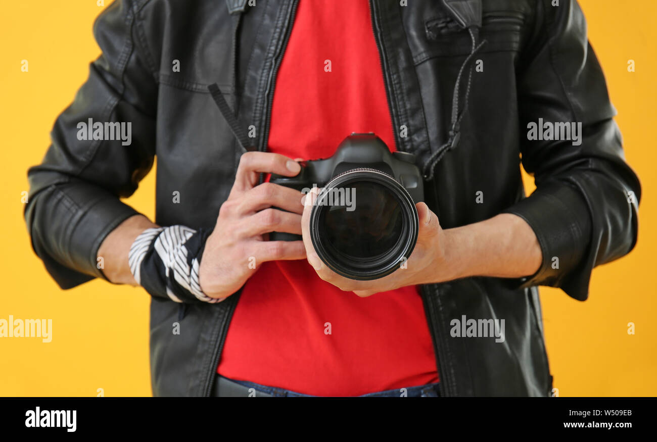 Male photographer on color background, closeup Stock Photo - Alamy