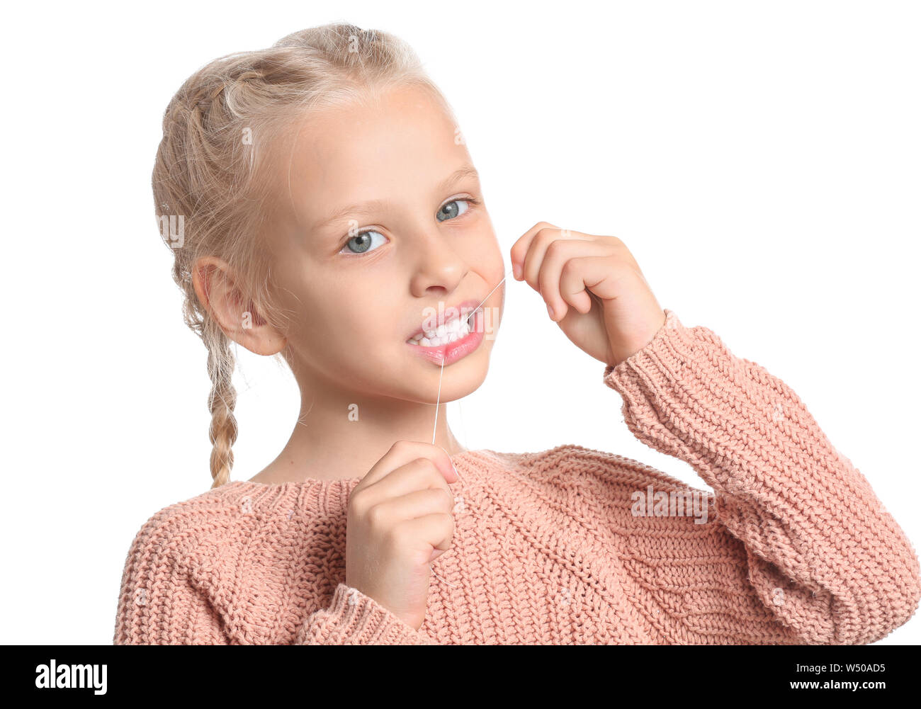 Little girl flossing teeth on white background Stock Photo Alamy