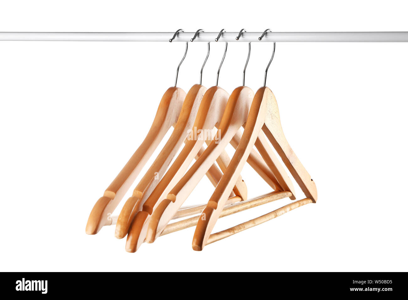 Rack with clothes hangers on white background Stock Photo - Alamy