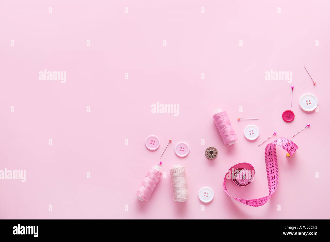 Set of sewing threads and accessories on color background Stock Photo ...