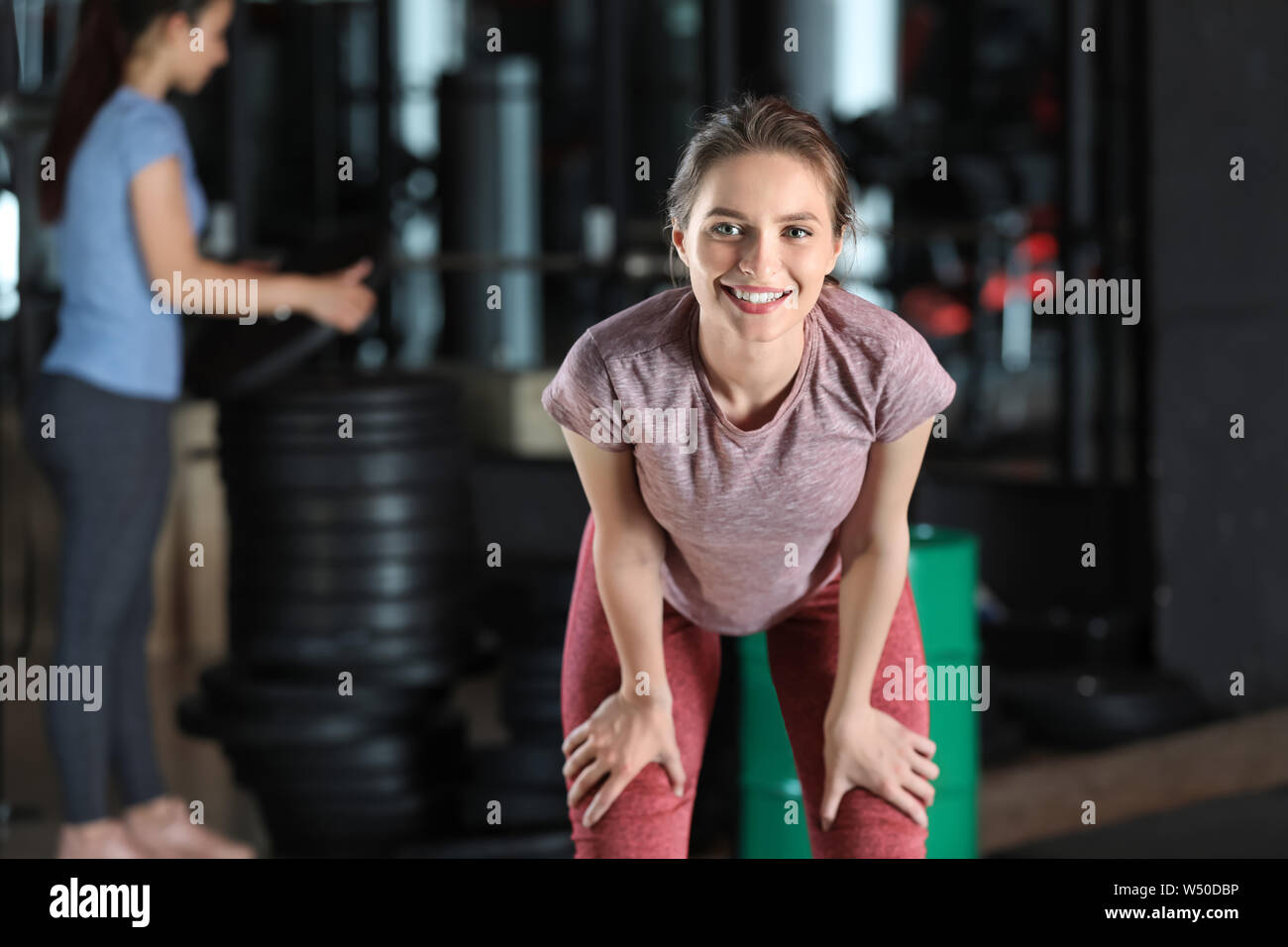 Sporty young woman in gym Stock Photo - Alamy
