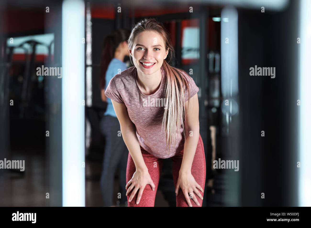 Sporty young woman in gym Stock Photo - Alamy