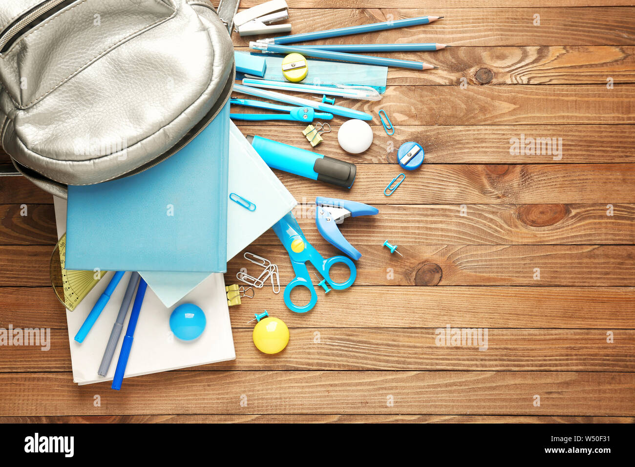 Different school stationery on wooden background Stock Photo