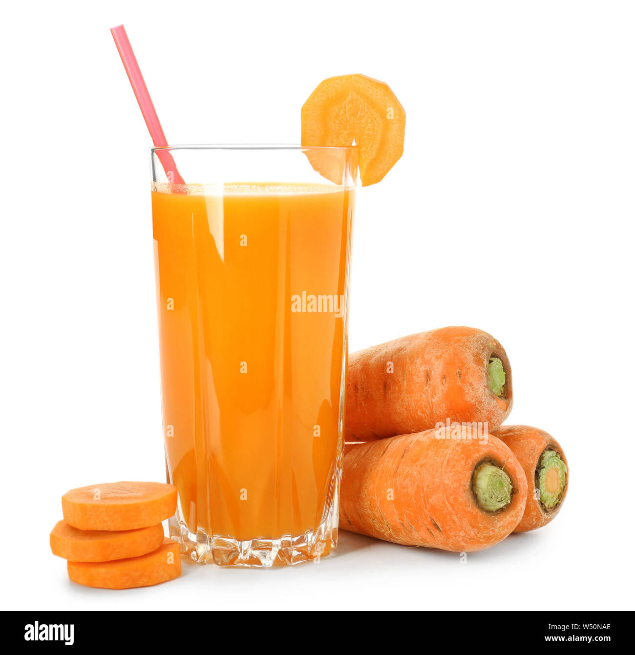 Glass of fresh carrot juice on white background Stock Photo Alamy