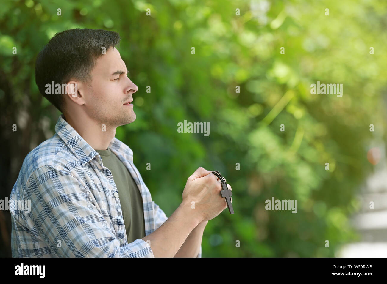 Religious man praying to God outdoors Stock Photo Alamy