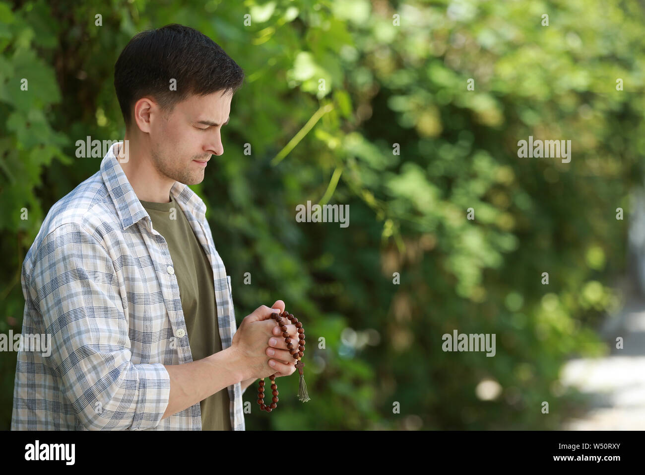 Religious man praying to God outdoors Stock Photo Alamy