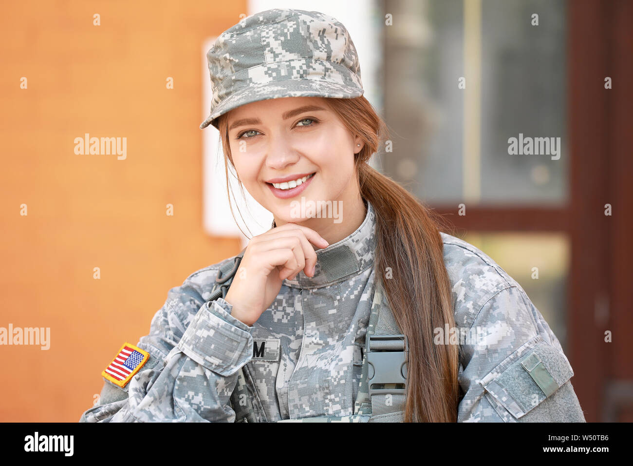 Happy young female soldier outdoors Stock Photo - Alamy