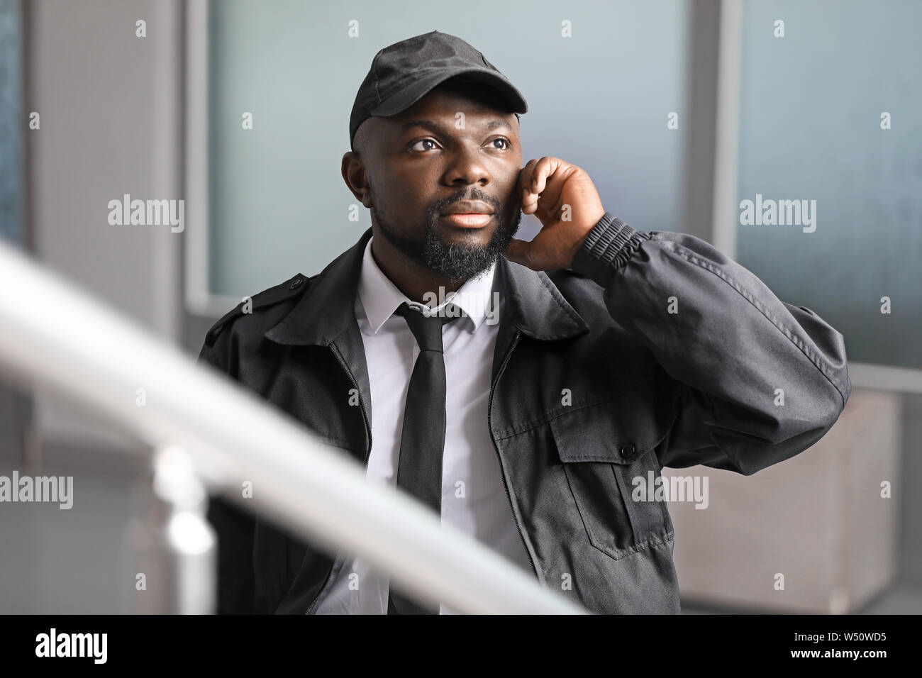 African-American security guard in building Stock Photo - Alamy