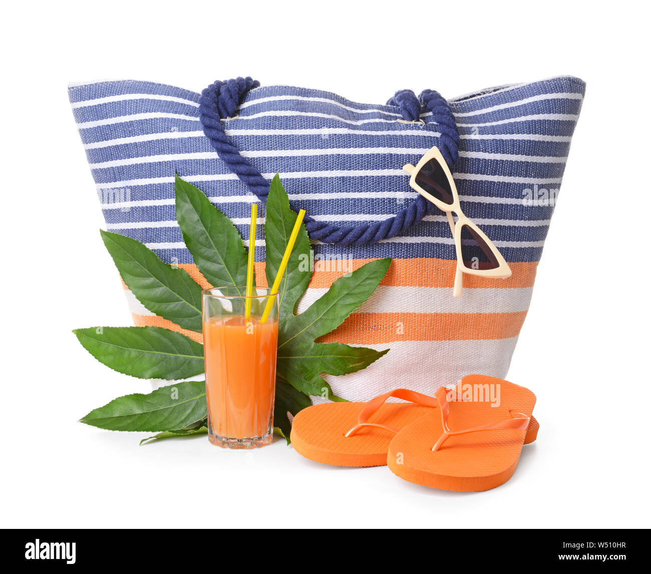 Beach bag, accessories and cocktail on white background Stock Photo