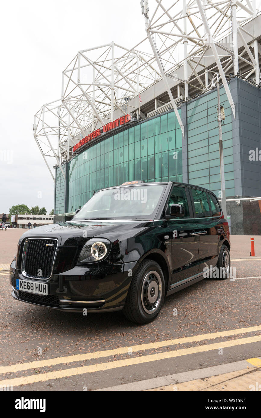 Electric black cab outside Old Trafford Football Ground Stock Photo