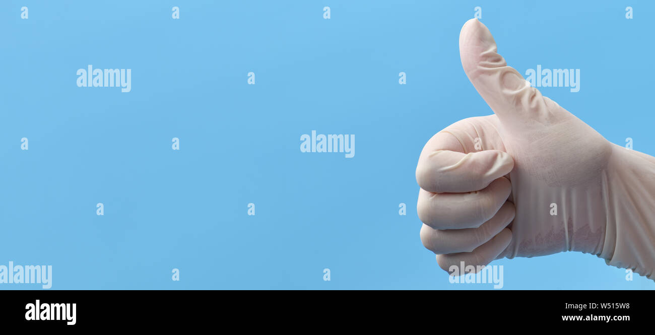 Banner. A fragment of a hand in white medical gloves that shows a thumbs up. Hand pointing up. Medical background Stock Photo