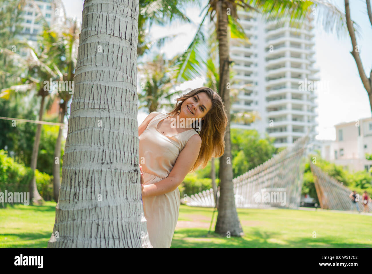 Girl Behind Coconut Tree High Resolution Stock Photography and Images -  Alamy