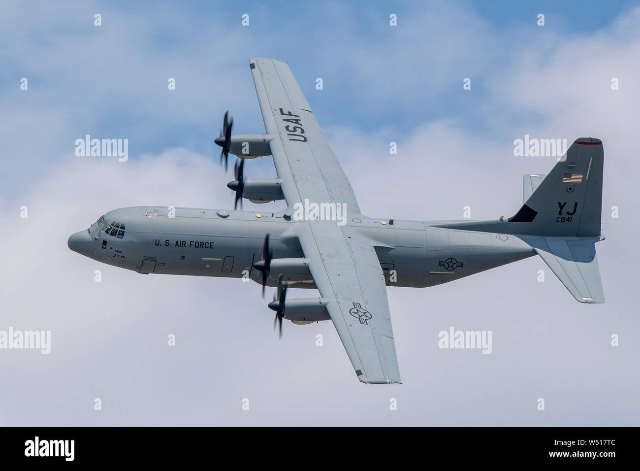 A C-130J Super Hercules assigned to the 374th Operations Group flies over Yokota Air Base, Japan during Col. Barry King’s, 374th Operations Group deputy commander, fini-flight, July 23, 2019. For many aircrew, the fini-flight is a way to recognize and honor fellow aviators for their dedication to the mission. (U.S. Air Force photo by Yasuo Osakabe) Stock Photo