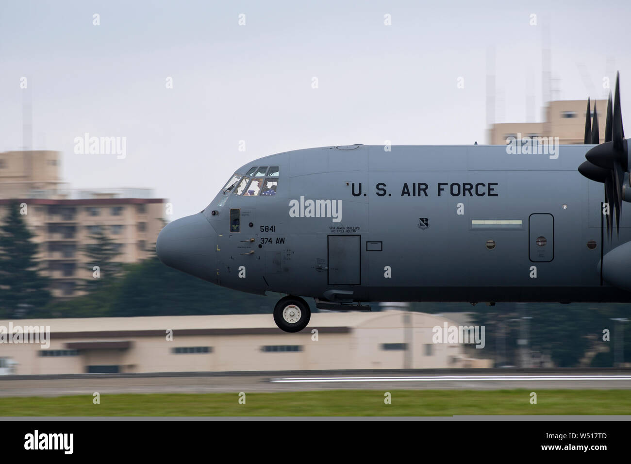A C-130J Super Hercules assigned to the 374th Operations Group approaches Yokota Air Base, Japan during Col. Barry King’s fini-flight, July 23, 2019. The fini-flight is a time honored tradition which gives pilot and crew a chance to celebrate their flying career one last time. (U.S. Air Force photo by Yasuo Osakabe) Stock Photo
