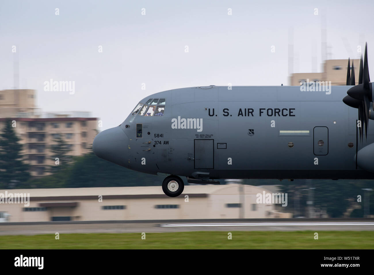 A C-130J Super Hercules assigned to the 374th Operations Group approaches Yokota Air Base, Japan during Col. Barry King’s fini-flight, July 23, 2019. The fini-flight is a time honored tradition which gives pilot and crew a chance to celebrate their flying career one last time. (U.S. Air Force photo by Yasuo Osakabe) Stock Photo