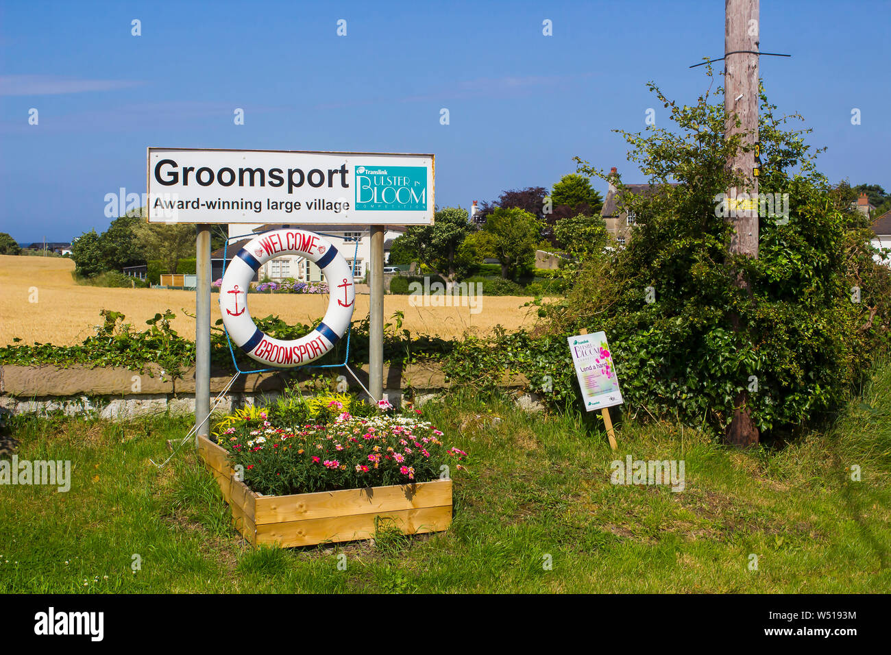25 July 2019 A large welcome sign on the outskirts of Groomsport Village in County Down. The sign shows the village is an Ulster in Bloom award winner Stock Photo
