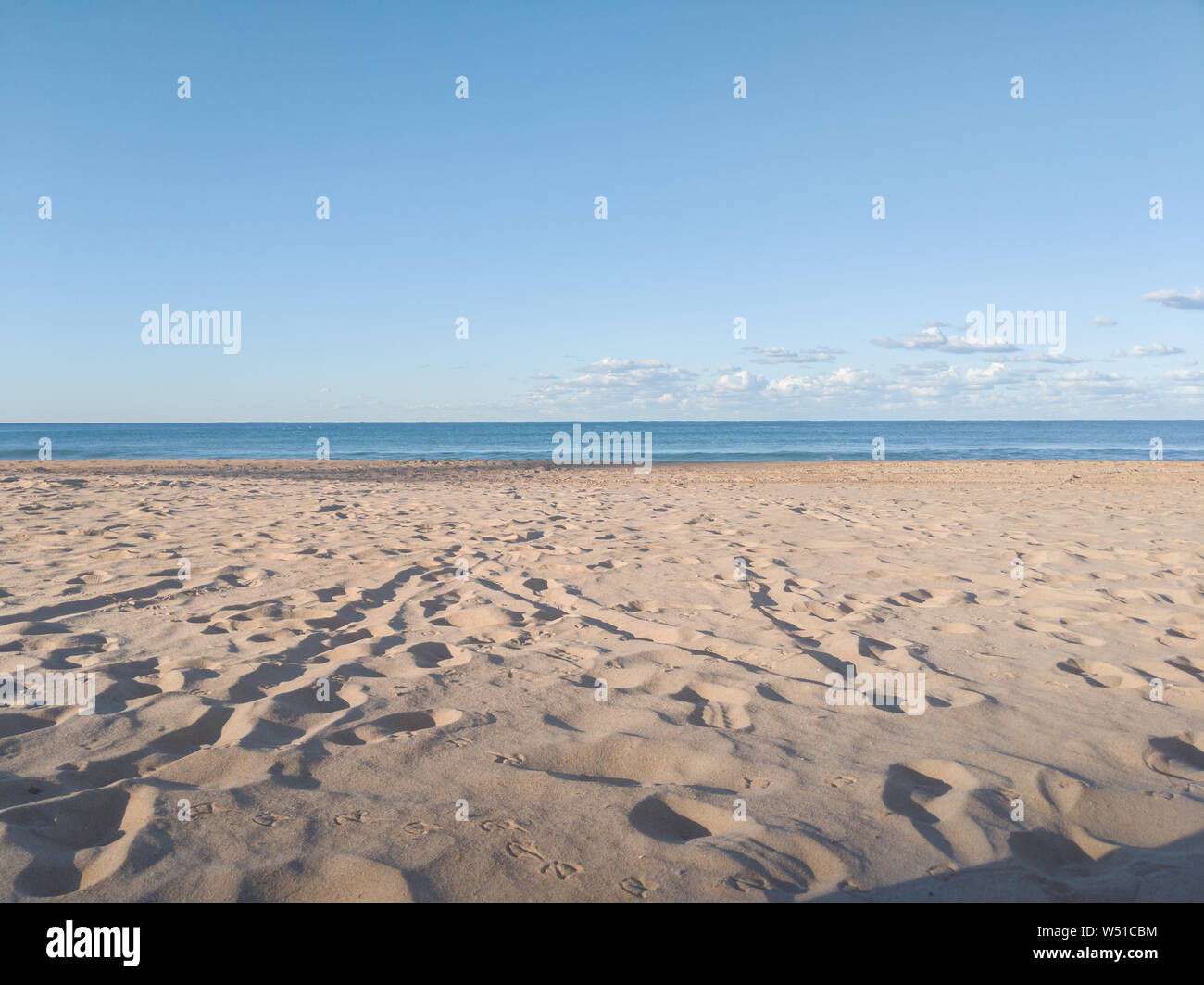 Manly Beach, Sydney, clear blue sky and footprints in the sand Stock Photo