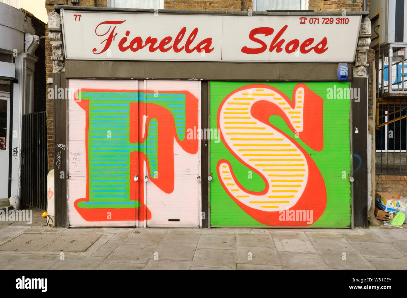Street Art, by Street Artist 'Eine', who paints gaint letters on shop window shutters, Hackney Road, London, Britain. Stock Photo