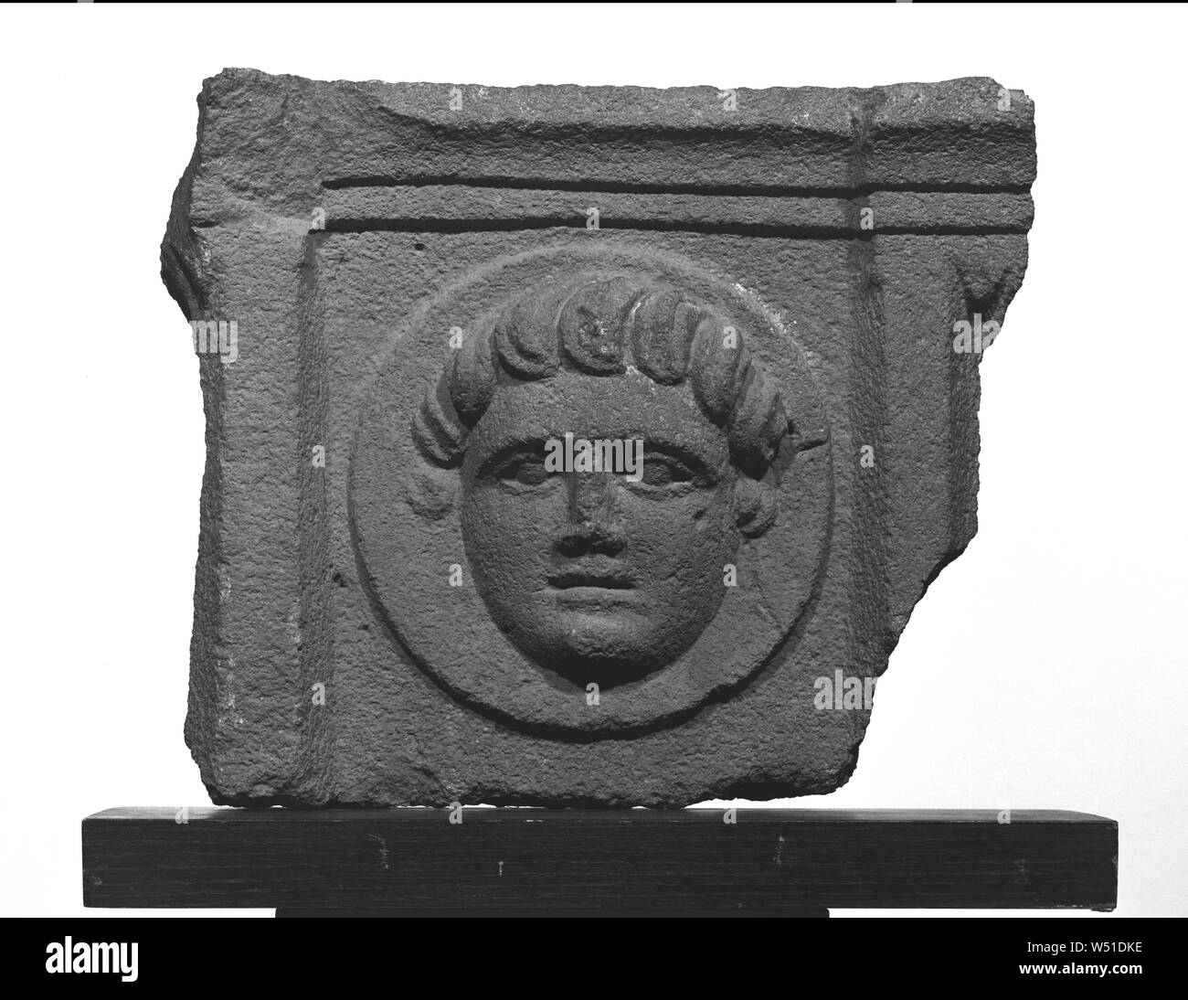 Architectonic Tondo Relief with Frontal Head, Unknown, Syria, 2nd century A.D., Hauran basalt, 38.5 × 42.5 cm (15 3/16 × 16 3/4 in Stock Photo