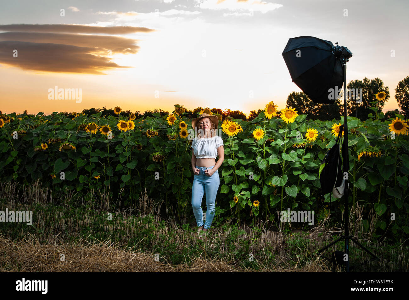 Beautiful curly hair woman model posing during photoshoot in a