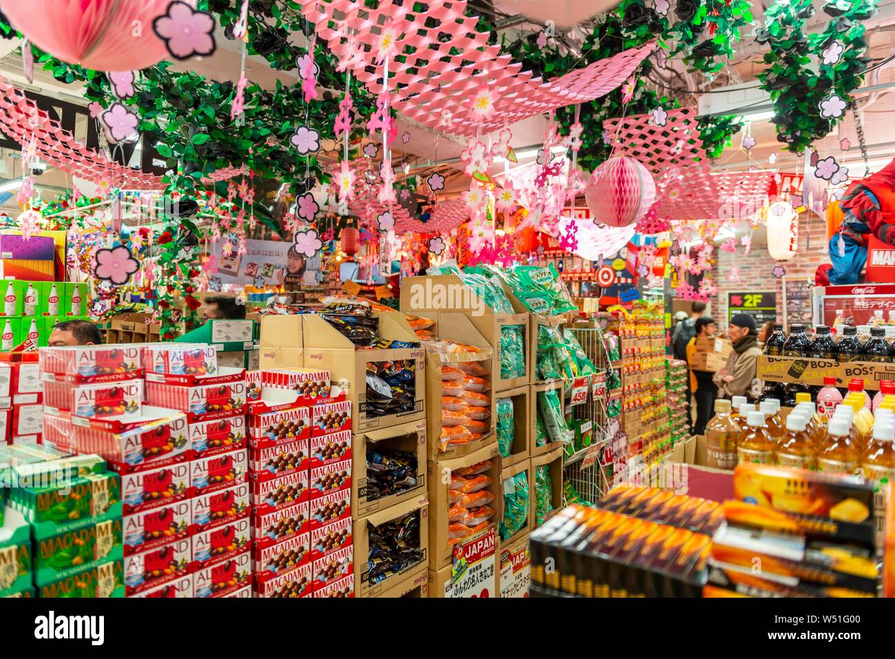 Piled packs of sweets in the decorated shop for the Hanami Fest, indoor photo, shopping mall Mega Don Quijote-Shibuya, Shibuya, Udagawacho, Tokyo Stock Photo