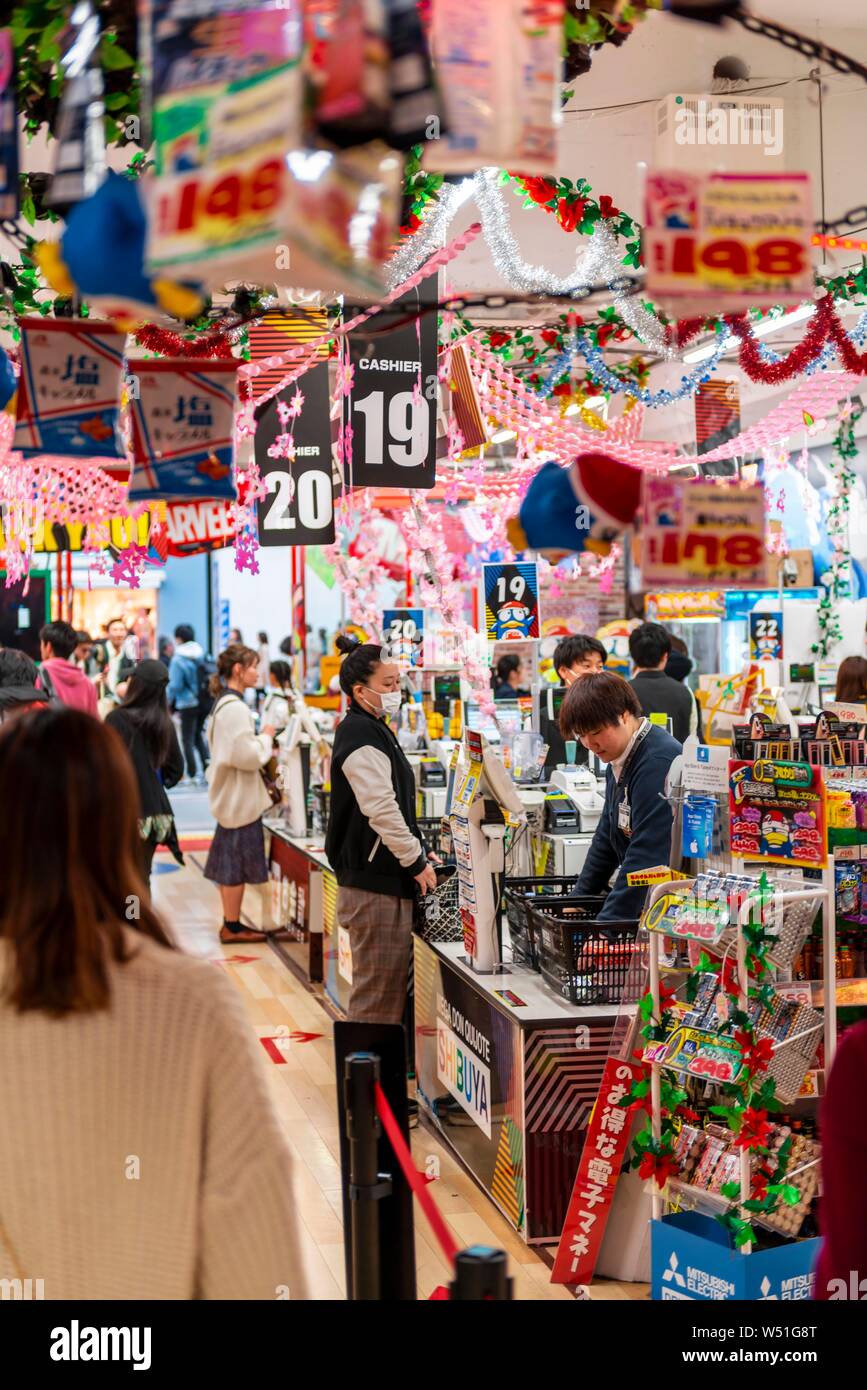 People buying eggs, decorated shop for Hanami Fest, indoor photo