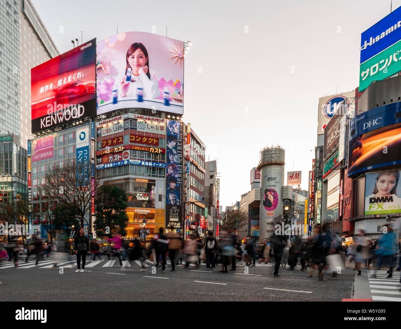 Shibuya Crossing, crossing with many pedestrians, many shopping centers and shops, illuminated advertising on skyscrapers, Shibuya, Tokyo, Japan Stock Photo