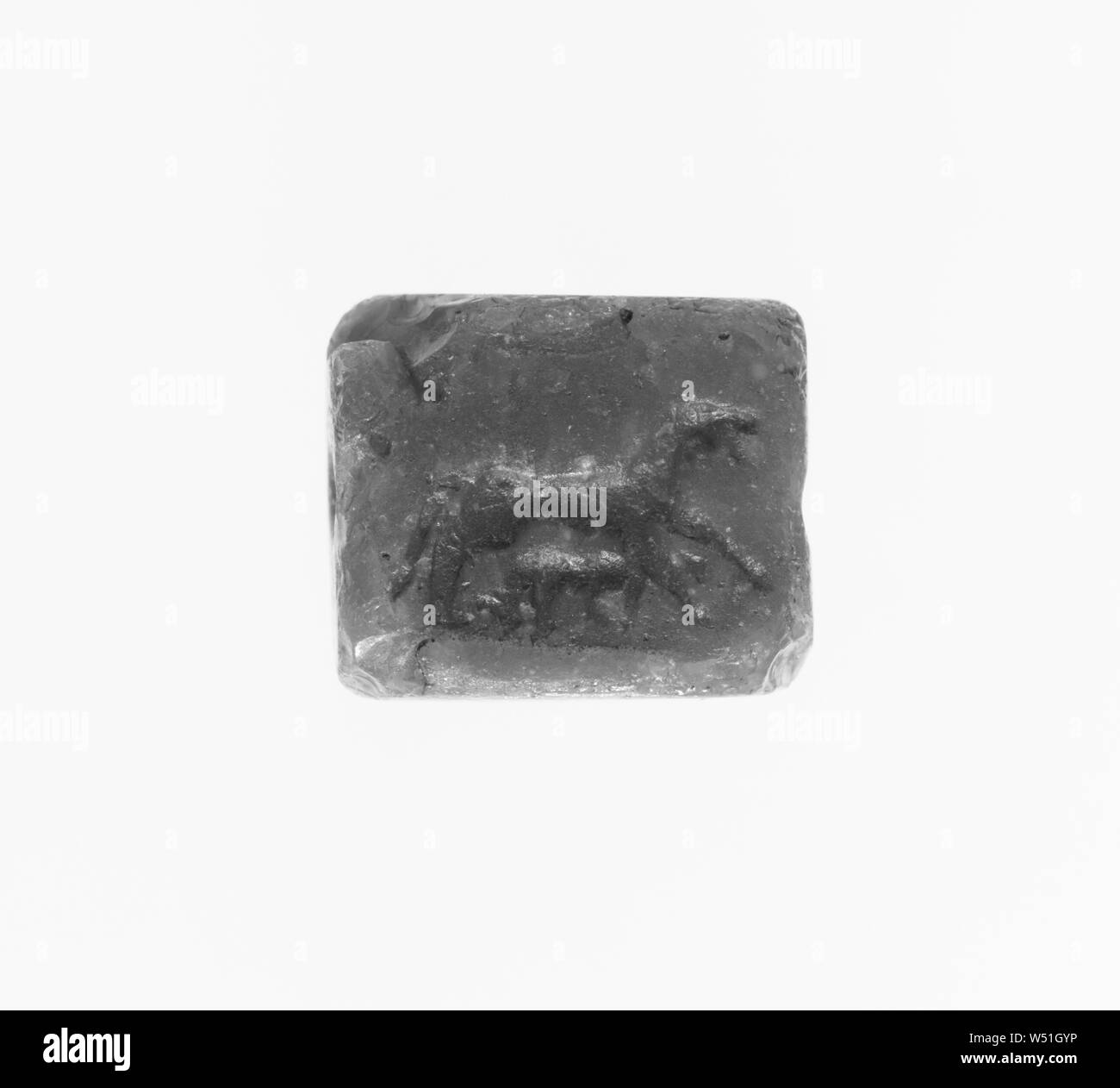 Engraved Tabloid, Unknown, Syria (?), 4th century B.C., Opaque blue glass, 1.7 × 1.5 × 0.9 cm (11/16 × 5/8 × 3/8 in Stock Photo