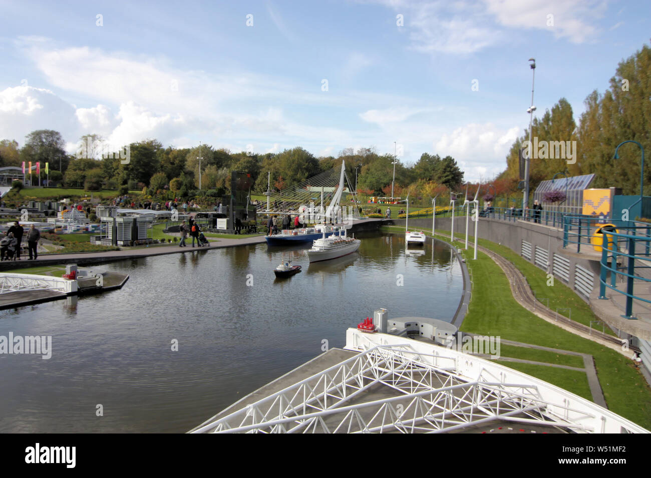 View of Netherlands harbor in Madurodam miniature park where visitors can see the replicas of ships and boats passing by to and fro on the sea. Stock Photo
